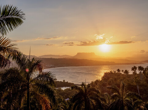View over Bahia de Miel towards city and El Yunque Mountain, sunset, Baracoa, Guantanamo Province, Cuba