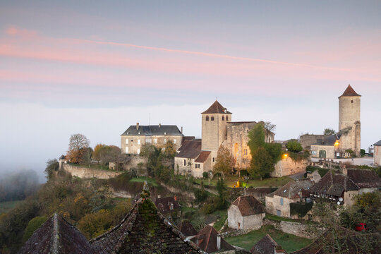 France, Midi-Pyrenees, Lot, Montvalent village illuminated before sunrise
