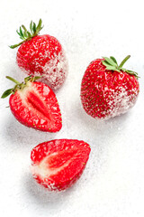 The berries of a ripe tasty strawberry lie on sugar. Summer berries. Background with strawberries. 