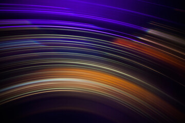 Full frame abstract image of vibrant light trails against black background
