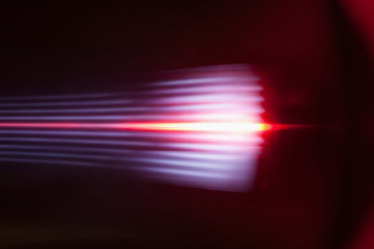 Abstract light trails against black background