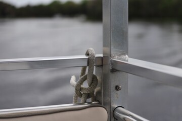 Rope tied in knot on back of boat