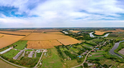 the plain in the vicinity of the village of Nizhny  - the Kipili River and wheat fields on a hot June day