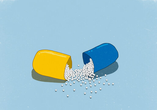 High angle view of open capsule on blue background