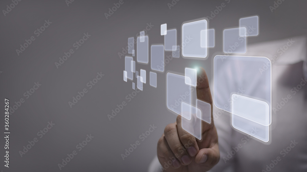 Wall mural businessman pushing on a touch screen interface