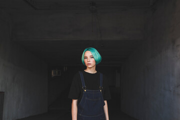 Portrait of teenage girl standing in basement