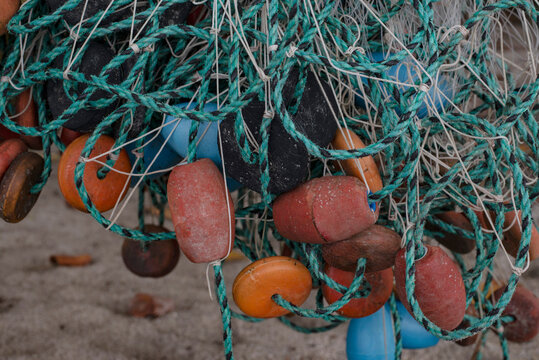 Close-up of tangled fishing net and buoys at beach, Tayrona, Columbia