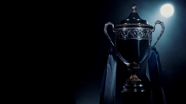 Silver trophy cup standing isolated. Premium award of sport achievement. Best prize for sport success. Brilliant result of playoff and championship. Concept of winner, breakthrough and champion