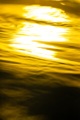 Abstract image of sunlight in the evening relfecting in rippled water