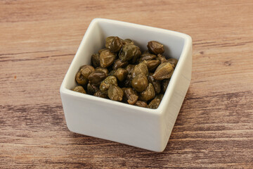 Tasty capers in the bowl