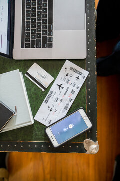 Smartphone, laptop, credit card and airline ticket