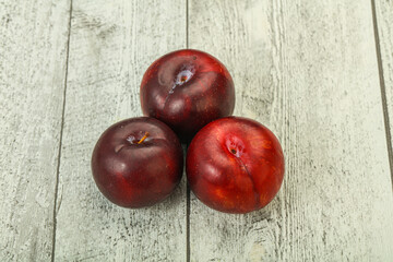 Ripe sweet plum fruit heap