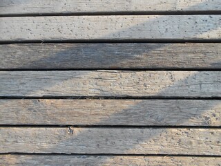 Old bridge wooden floor in the sun