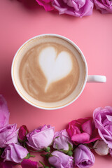 cup of coffee around may roses against pink background. romantic and beauty concept  . close up