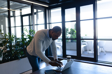 African American man working on his laptop