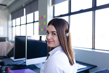Caucasian woman working with headphone set 