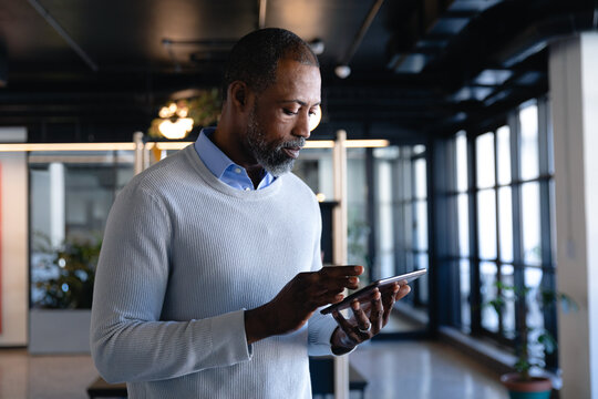 African American man using a digital tablet