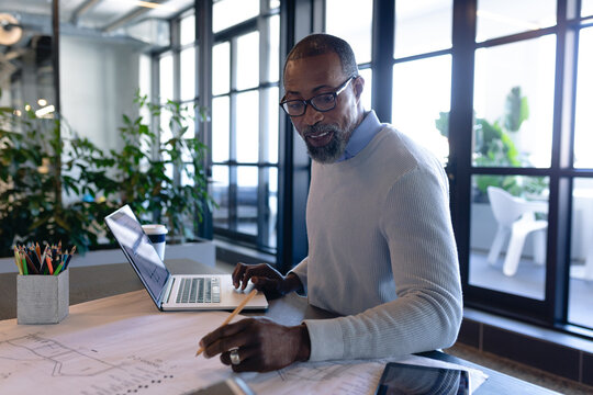 African American man working in modern office 