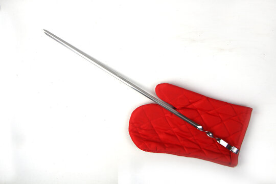 spitter and red glove on white background flat lay