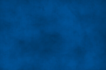 Fototapeta na wymiar Dark painted surface in navy blue tones. Variety paint spots on wall. Mixed media backdrop