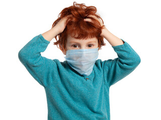 A beautiful European red-haired boy of 5 years in a mask against coronavirus. Pandemic, epidemic...