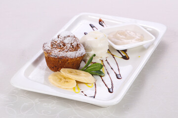 Tasty hot muffin with ice cream