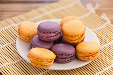 tasty fresh delicious macaroons on  plate
