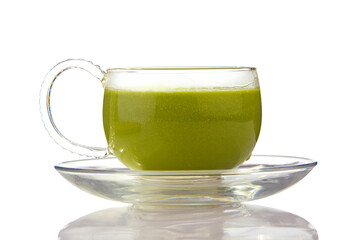 Green drink in a beautiful glass on White background