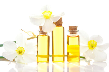 Essence of flowers  on white in beautiful glass jar