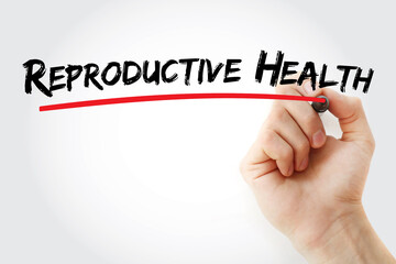 Reproductive Health text with marker, health concept background