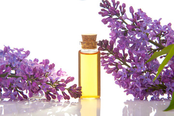 Essence of flowers on White background in beautiful glass jar