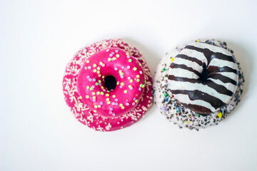 Top view of four colorful sweet donuts. On top of each other. Dessert colorful snack. Donuts set isolated on a white background. Space for text.