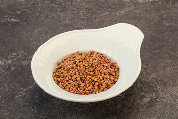 Raw buсkwheat cereal in the bowl