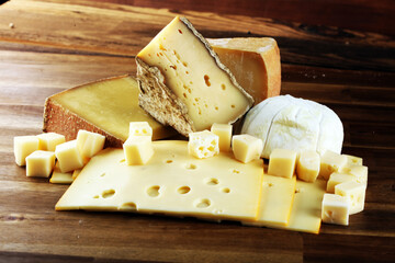 various types of organic cheese on rustic vintage table