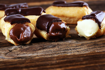 Traditional French dessert. Eclair with chocolate icing. Pastery dessert concept