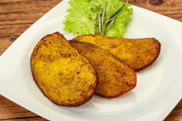Baked potato with herbs and spices