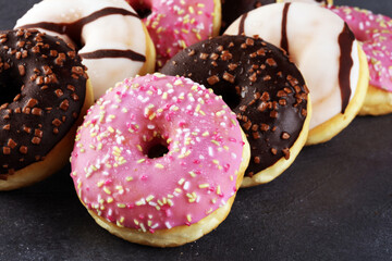 donuts in different glazes frosted with sprinkles