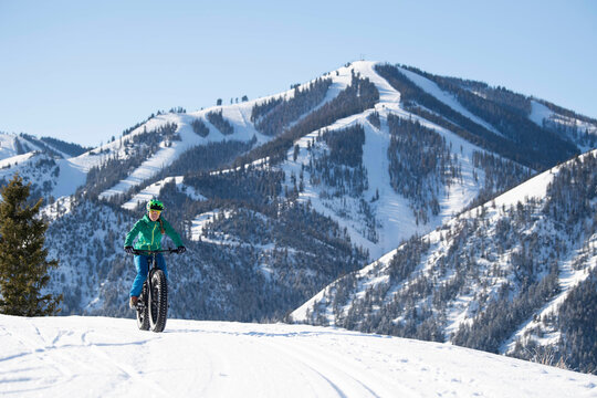 A woman riding her fat bike on a beautiful winter day in Sun Valley.