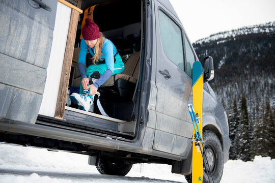 A woman getting ready for a day of backcountry skiing.