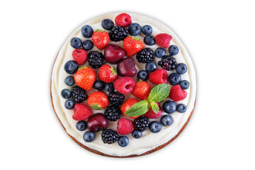 Cake with cream cheese frosting, mint leaves and berries jn a white isolated background