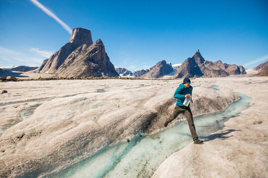 Active map jumps over glacial river surrounded by mountains.
