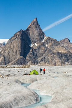 Climbers at basecamp on glacier below Mt. Loki, Baffin Island.
