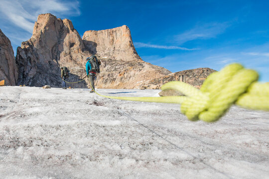 Detail of climbing rope attached to climbing team in the mountains.
