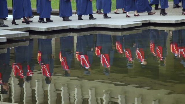BURNABY BC - OCT 9 2014 Reflection of University graduates in a pond.