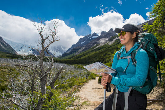 Woman hiking in the Andes mountain range towards Cerro Torre