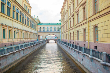 Fototapeta na wymiar View of canal in beautiful city in Saint Petersburg. Buildings from both sides of the river.