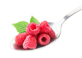 Ripe raspberries with a green leaf in a spoon close-up. Isolated