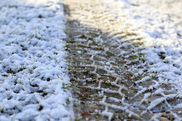 car wheels marks on snow