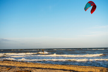 kite on the beach. Kitesurfing at the sea in windy weather