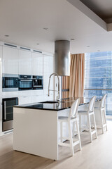 Elegant white kitchen with kitchen island